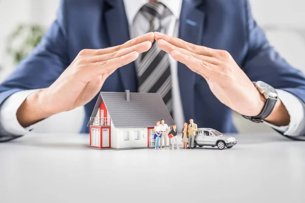 Depositphotos 226809952 stock photo insurance agent house toy safety